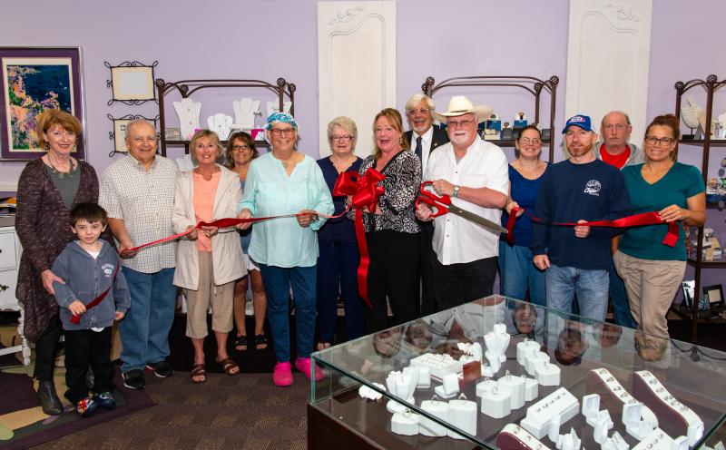 Conversation Peace Jewelers ribbon-cutting attendees are in back (l-r) Marie Gungui, Marie Talley, Bill Lucks of Keller Williams Realty, Tiffany Saul and Rich Schaller. In front are Betsy Reamer, Lewes Chamber of Commerce executive director with grandson Augie Kunzelman; Vito Salvatore; Kathryn Salvatore; Mary Louise Lauffer Butler, virgin sea glass artist; Ingrid K. Handle and Sam Handle, co-owners; Brian Ashley, Cape Custom Painting; and Lisa Butler. SUBMITTED PHOTO